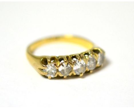 A diamond five stone ring, the graduated old cut diamonds in yellow claws, on a plain polished shank, total estimated diamond