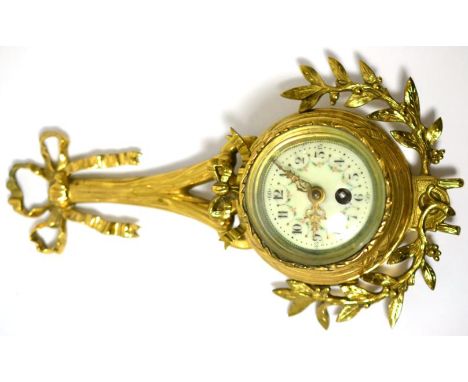 A small gilt metal cartel timepiece, circa 1920, case with a bow and floral mounts, Arabic enamel dial, single barrel movemen