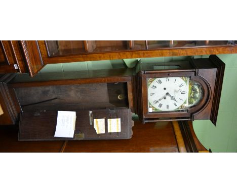 ^An oak eight day longcase clock, circa 1800, flat top pediment, 12-inch arched painted dial, shell decorated corners, arch w