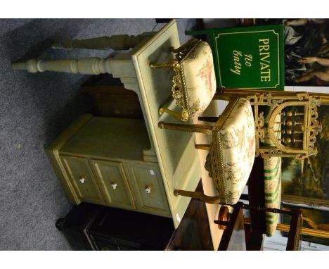 A green painted dressing table fitted with three drawers, a gilt bobbin turned nursing chair and a footstool upholstered to m