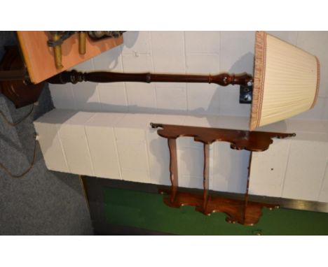 A mahogany standard lamp and shade together with a set of three tier mahogany hanging shelves