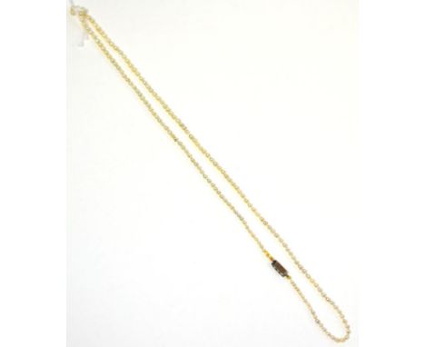 A pearl necklace, the graduated pearls knotted to an oblong catch set with three rose cut diamonds, length 51.5cm   Accompani