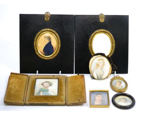 An early 20th century portrait miniature of a young girl in a gilt tooled leather case; together with five other portrait min