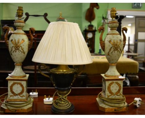 A pair of green painted porcelain Campana shaped table lamps with gilt handles modelled as birds, 53cm high, together with an