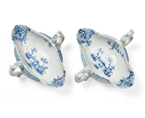 A pair of First Period Worcester two handled sauce boats painted in underglaze blue with the two handled sauce boat landscape