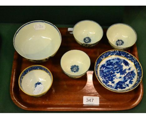 ^A first period Worcester pagoda pattern tea bowl and saucer; a similar mother and child pattern tea bowl; a pair of Liverpoo