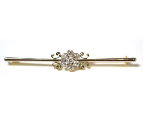 A diamond cluster bar brooch, a central cluster of seven old cut diamonds in white millegrain settings, between pairs of scro