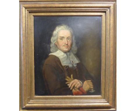 Manner of Samuel Cooper (1609-1672) Portrait of a gentleman, half length, wearing a white collar, brown jacket and holding a 
