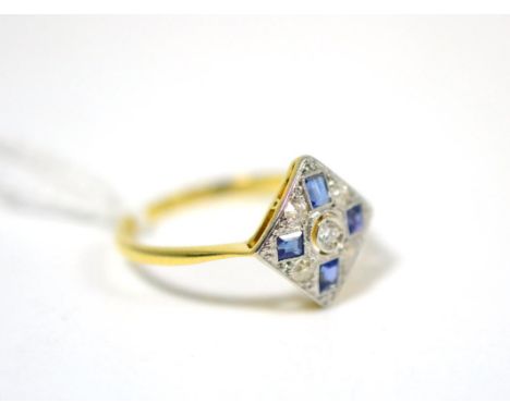 An Art Deco sapphire and diamond cluster ring, an old cut diamond in white millegrain setting within a border of step cut sap