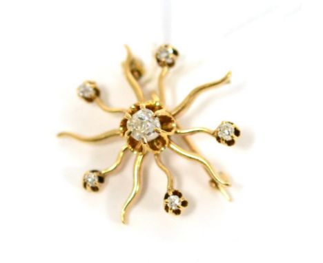 A diamond star brooch, an old cut diamond centrally, within wavy radial arms, alternating arms with diamond terminals, total 