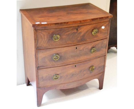 A mahogany bow fronted three drawer chest on bracket feet 