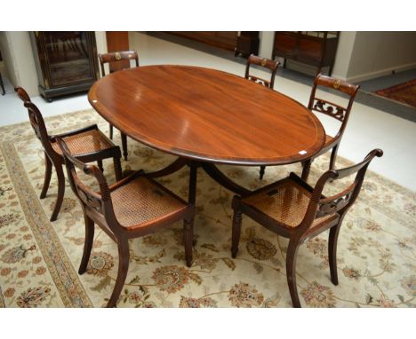 A set of six Regency rosewood and cane seated music room chairs, early 19th century, the curved top rails inlaid with brass m