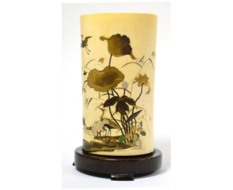 A Japanese ivory tusk vase, Meiji period, inlaid in lacquer and mother-of-pearl with birds amongst lilies, on a hardwood stan