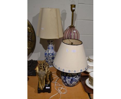 A Chinese blue and white prunus decorated table lamp converted to electricity, a 20th century Chinese vase converted to a tab