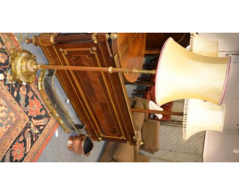 A late 19th century brass adjustable standard lamp, a brass pierced fire curb and a copper coal helmet (3) 