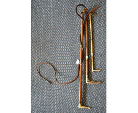 A hunting whip with leather thong and two crops, all with antler handles 