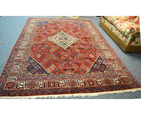 A Joshaghan carpet, Central Iran, The burgundy lattice field of stylised plants centred by a stepped diamond medallion framed