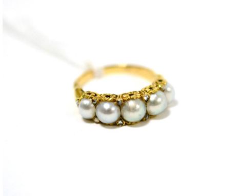 A Victorian split pearl and diamond ring, five split pearls with pairs of rose cut diamond accents between each, and accents 