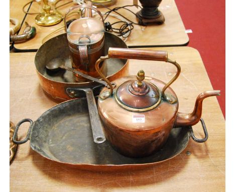 A Victorian copper watering can; together with a large 19th century copper saucepan; a copper range kettle; a twin handled bo