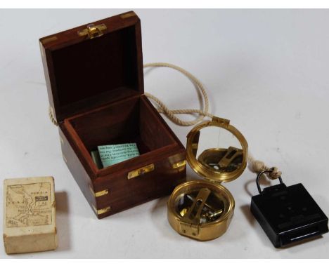A reproduction brass cased pocket compass in fitted brass bound box together with a TG &amp; Co. Ltd military marching compas