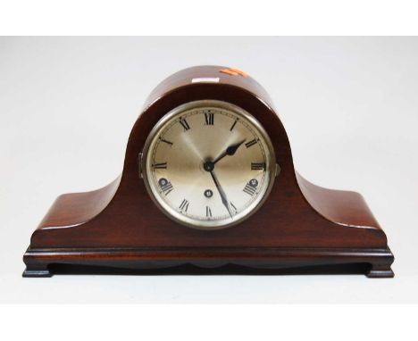 An early 20th century mahogany cased mantel clock, the silvered dial showing Roman numerals,having 8-day movement, standing o