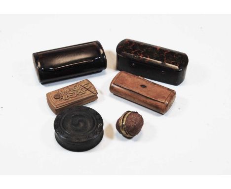 A late 19th century pocket snuff box in the form of a walnut, having brass mount; together with a lacquered faux serpentine p