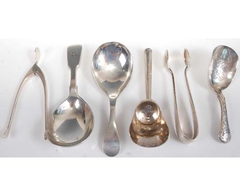 Assorted silver caddy spoons, to include a Victorian shovel example with engraved handle, a Victorian example in the Fiddle p