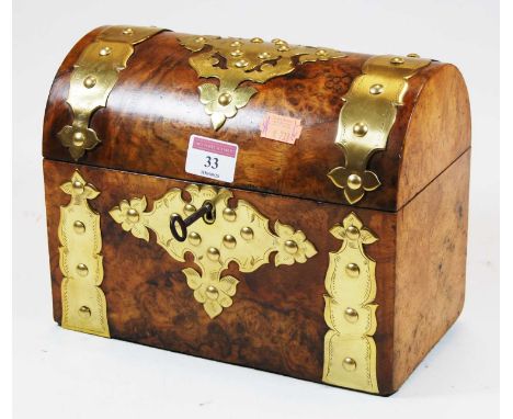 A Victorian burr walnut tea caddy, with domed lid, ornate brass mounts and fitted twin compartment interior, w.23cm