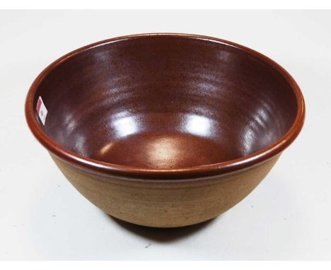 A John Leach brown glazed studio pottery bowl, dia.31cm