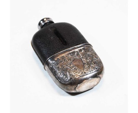 A late Victorian pocket hip flask, having a leather clad glass body, with removable silver plated cup, etched with flowers an