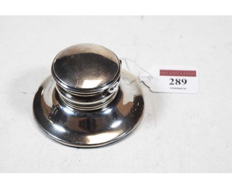 An Edwardian silver capstan inkwell, of plain undecorated form, on loaded base