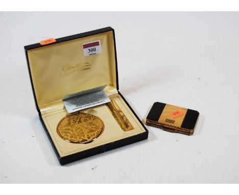 A lady's Stratton gilt brass powder compact, decorated with butterflies amongst foliage, together with a matching atomiser, i