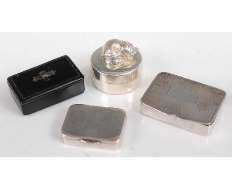 A silver pill box, having engine turned hinged cover, Birmingham 1936, 3.5cm; together with one other Edwardian example; a mo