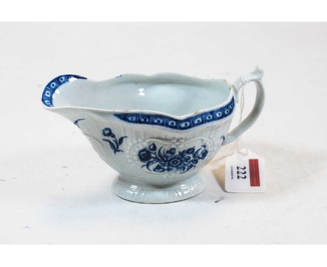 An 18th century Worcester porcelain relief moulded blue & white decorated sauce boat, crescent C mark verso (hairline) width 