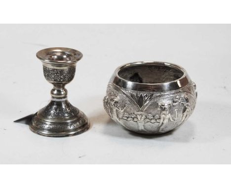 A Middle Eastern white metal dwarf candlestick; together with an Indian white metal and embossed sugar bowl, gross weight 8.7