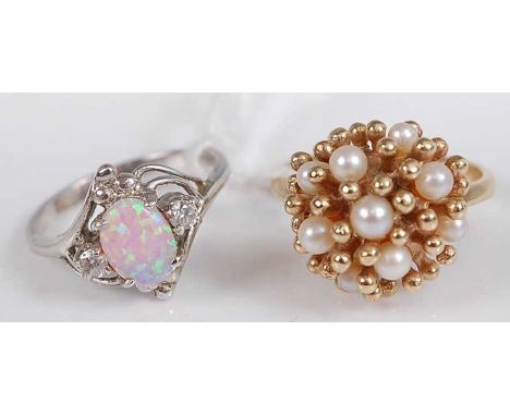 A contemporary 9ct gold and cultured seed pearl set lady's dress ring, 6.1g, size Q; together with a white metal opal and cz 