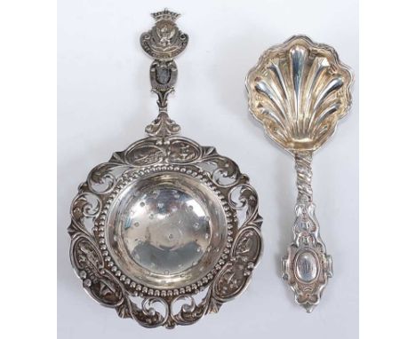 A mid-Victorian silver caddy spoon, having shell shaped bowl, London 1868, 10cm; together with a white metal continental silv