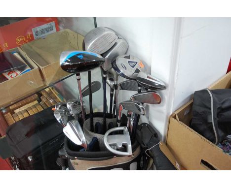 Various golf clubs, to include irons, drivers etc; together with a Dunlop canvas bagCondition report: Please note that we wou