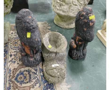 Three garden ornaments, two lions and boot