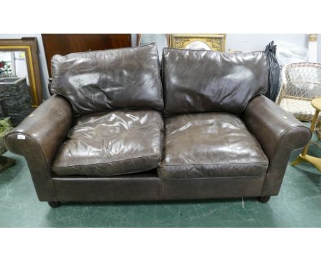 Modern brown leather two seater sofa bed.
