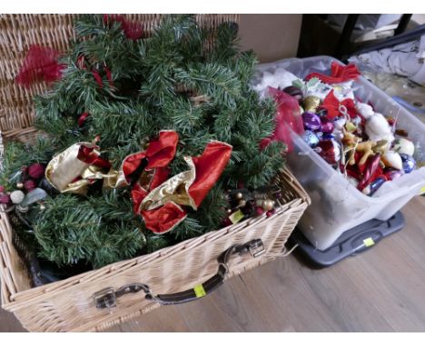 Wicker hamper and box of wreaths and Christmas ornaments