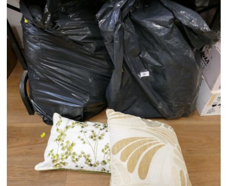 Three bags of sofa cushions