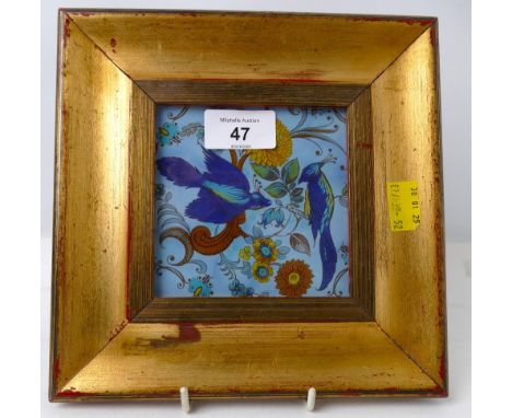 Decorative tile in gold coloured frame