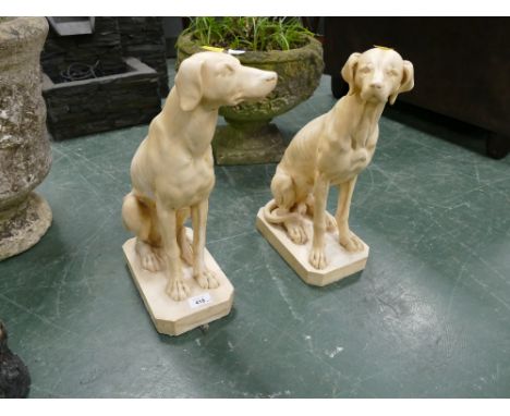 Two dog form garden ornaments