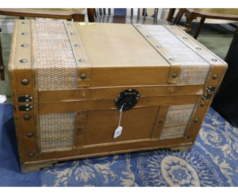 Modern storage box in form of a travel trunk