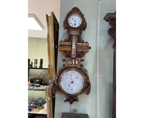 Carved oak combination barometer-clock-calendar.