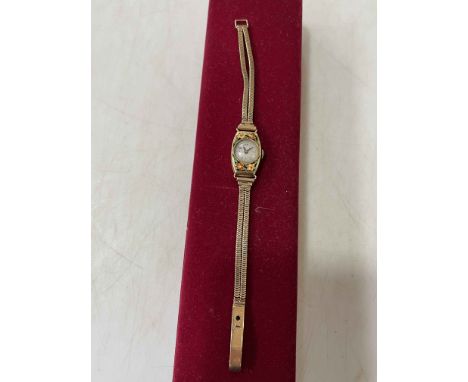 Ladies 18 carat gold wristwatch with enamel decoration and cabachon winder, with 9 carat gold bracelet.