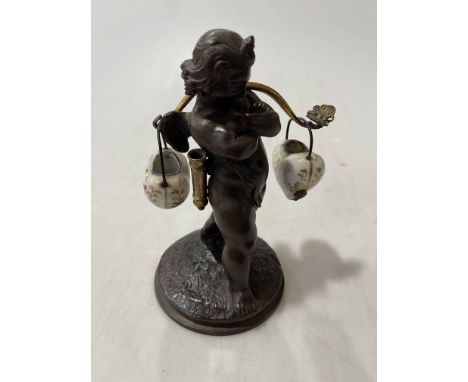 Victorian Cupid figure with gilt bow and porcelain hearts, 15cm.