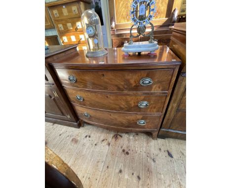 19th Century mahogany bow front chest of three long graduated drawers on splayed legs, 84cm by 92.5cm by 51cm.