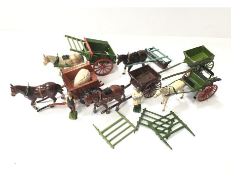 Six Britains Farm Series carts, including 9F Horse Roller with Man, overall F-G (some repainting). Together with Britains Far